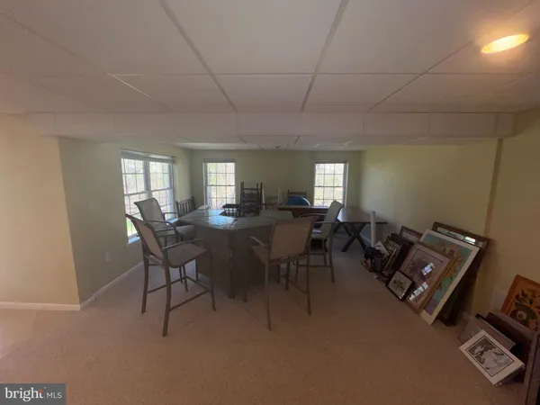 a view of a livingroom with furniture and window in it