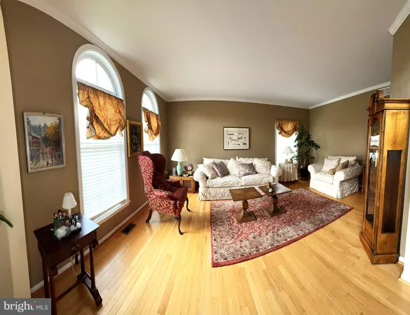 a living room with fireplace furniture and a flat screen tv