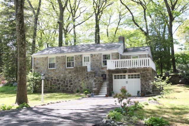 27 Range Road Rowayton, CT 06853 - Photo 1 of 21 a front view of a house with a garden