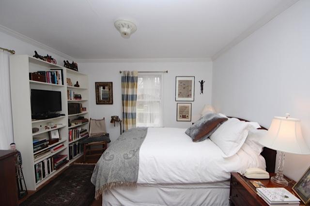 27 Range Road Rowayton, CT 06853 - Photo 12 of 21 a bedroom with a bed and a flat screen tv