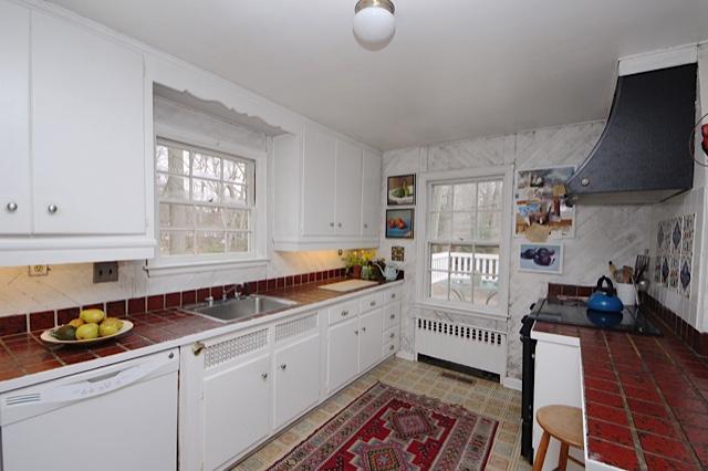 27 Range Road Rowayton, CT 06853 - Photo 9 of 21 a kitchen that has a lot of cabinets in it and wooden floors