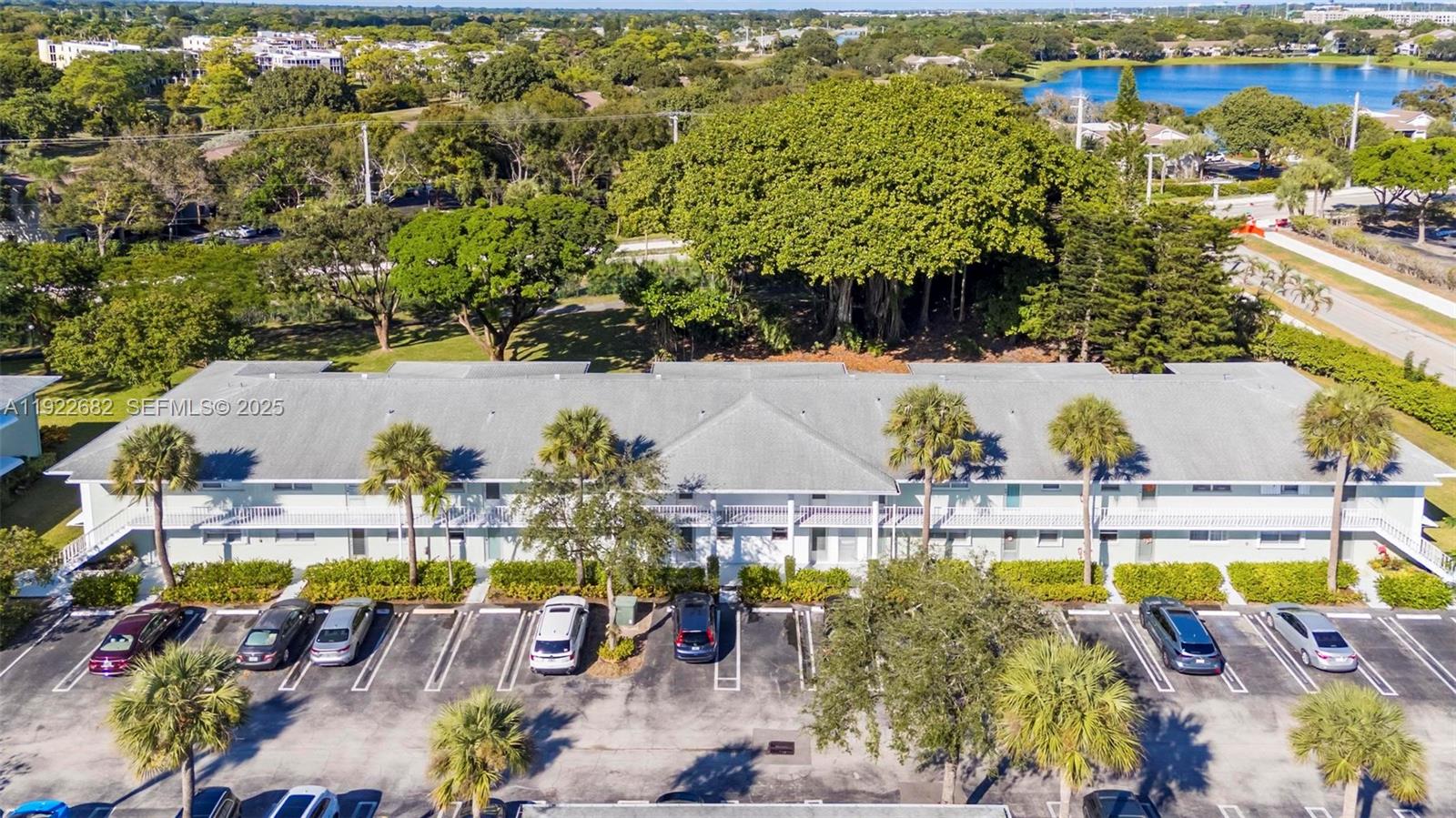 2300 Southwest 22nd Avenue, Unit 109 Delray Beach, FL 33445 - Photo 23 of 49 an aerial view of a swimming pool with outdoor seating