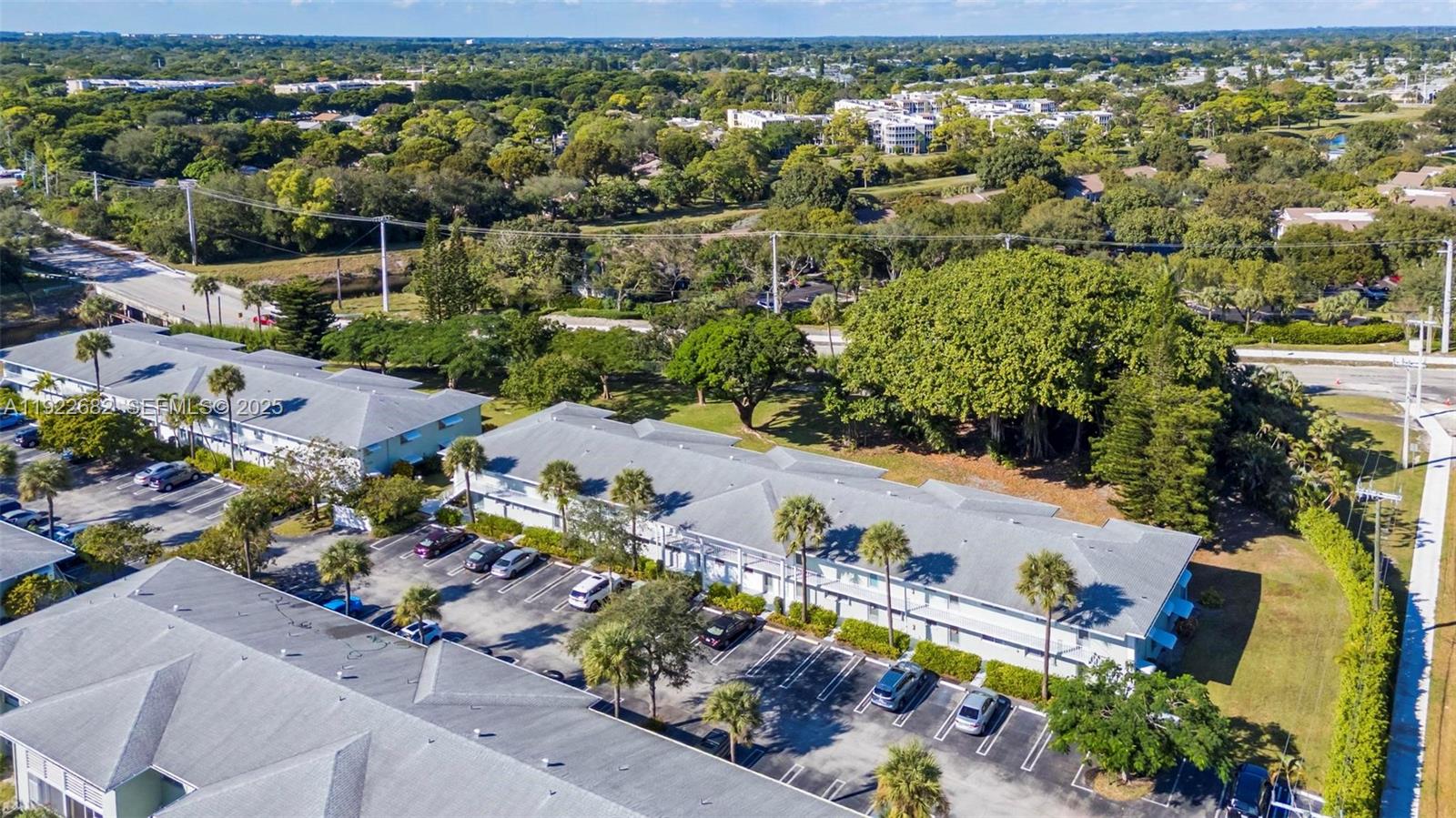 2300 Southwest 22nd Avenue, Unit 109 Delray Beach, FL 33445 - Photo 25 of 49 an aerial view of a city with lots of residential buildings