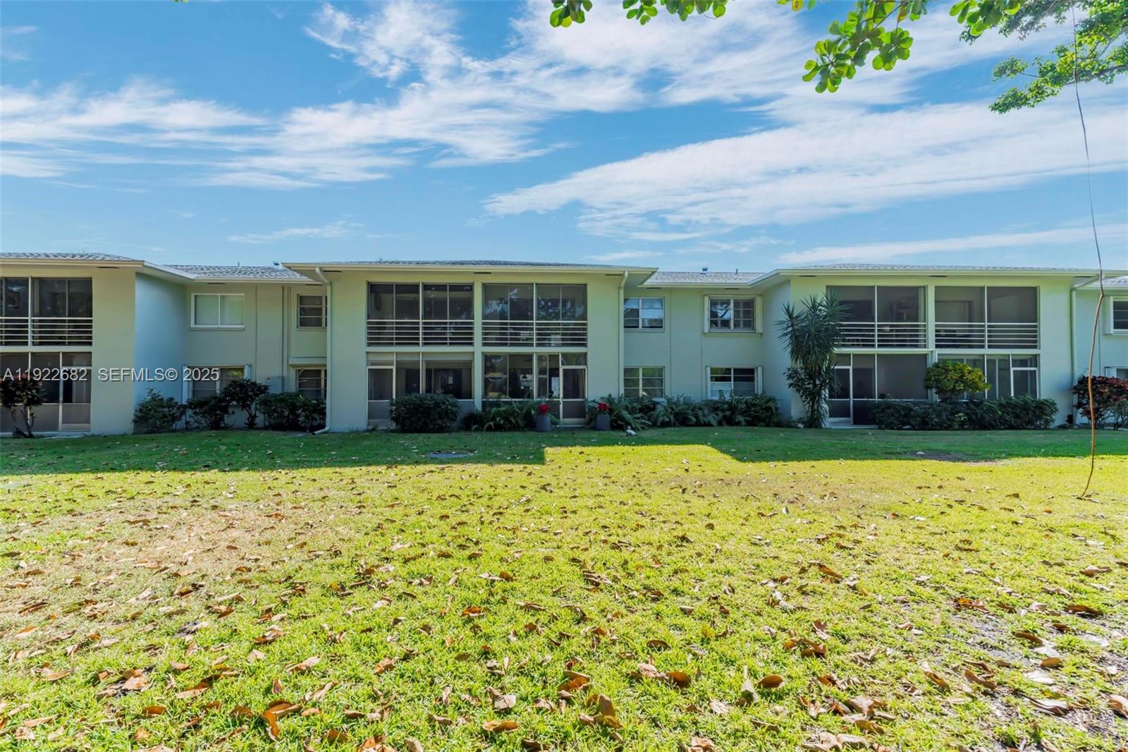 2300 Southwest 22nd Avenue, Unit 109 Delray Beach, FL 33445 - Photo 28 of 49 front view of a house with a yard