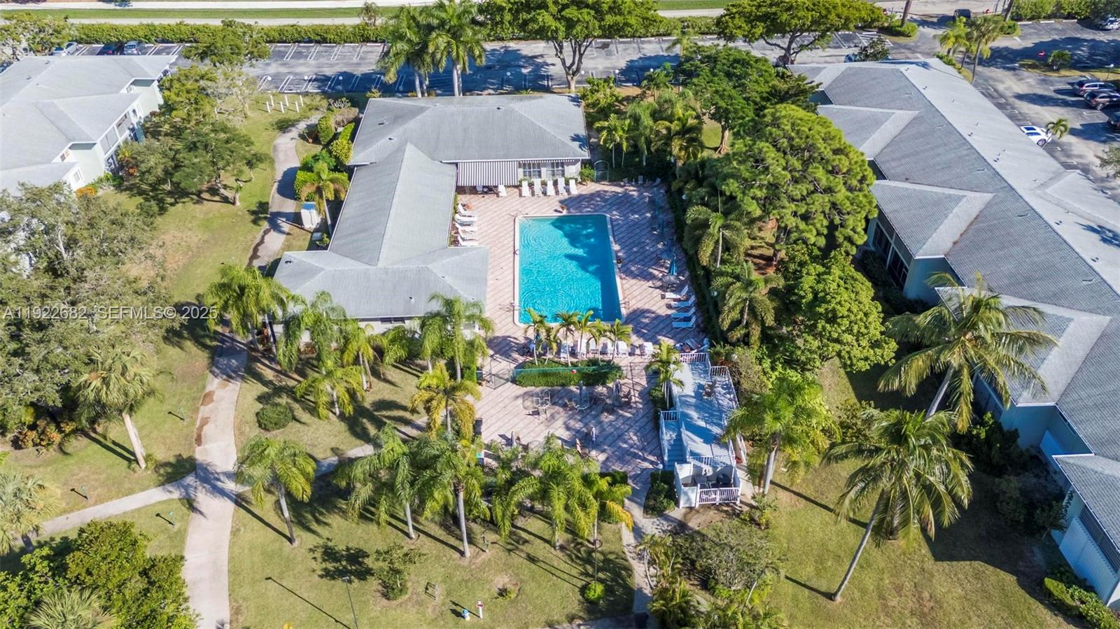 2300 Southwest 22nd Avenue, Unit 109 Delray Beach, FL 33445 - Photo 29 of 49 an aerial view of a house with a yard and garden