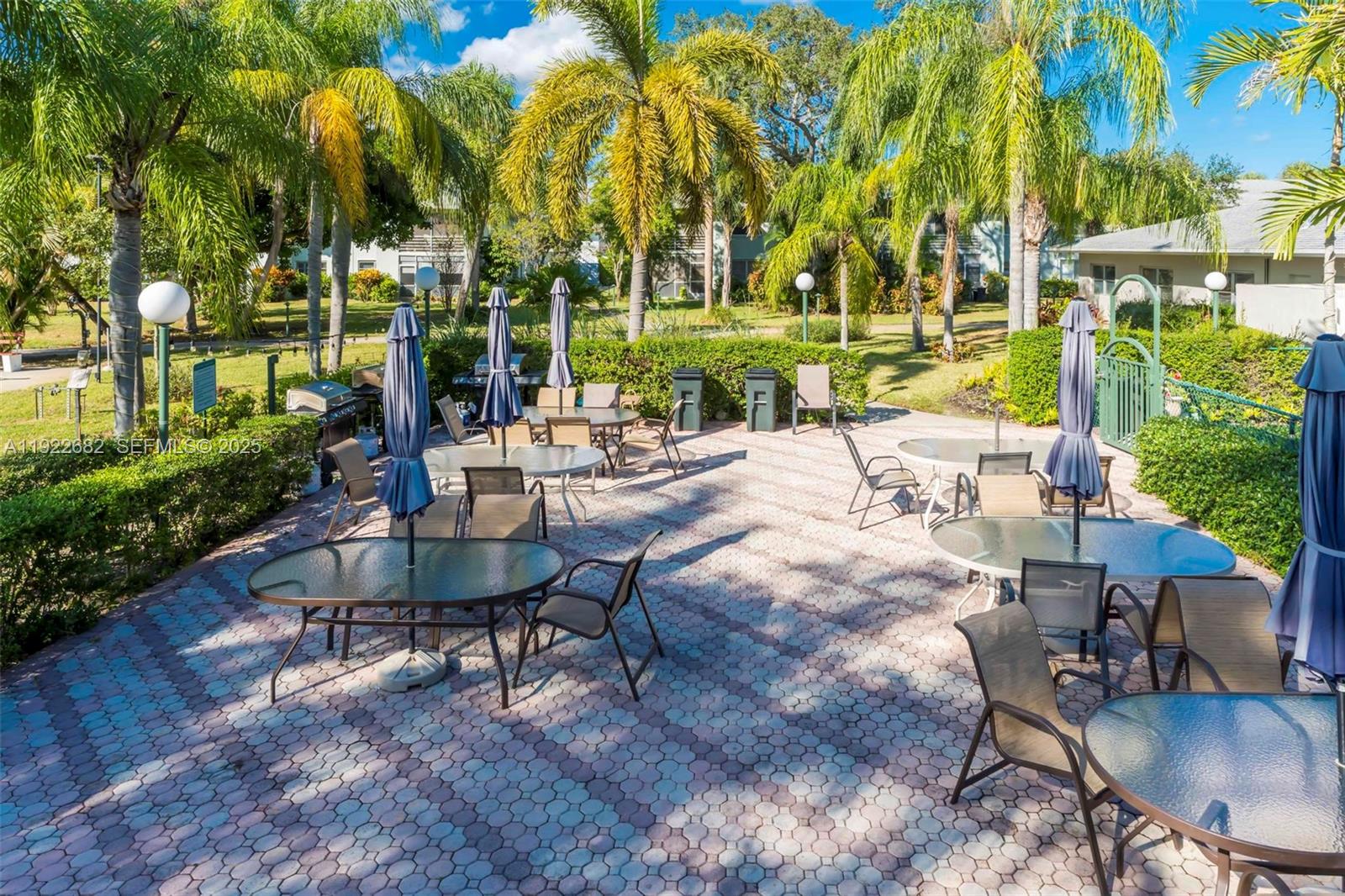 2300 Southwest 22nd Avenue, Unit 109 Delray Beach, FL 33445 - Photo 38 of 49 a view of a backyard with sitting area