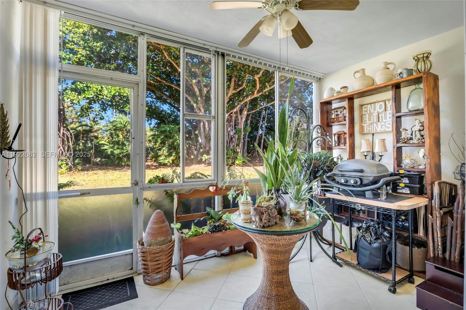 2300 Southwest 22nd Avenue, Unit 109 Delray Beach, FL 33445 - Photo 9 of 49 a view of a dining room with furniture window and outside view