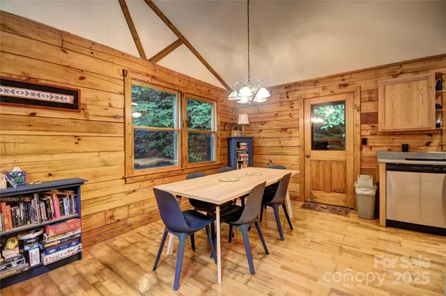 a kitchen with a refrigerator a stove a sink and a window