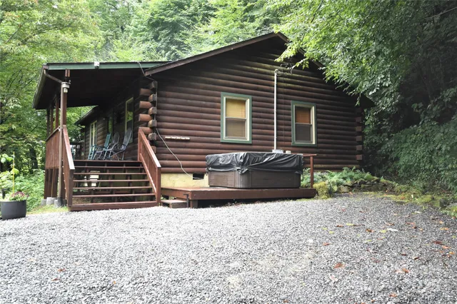 a front view of house with a garden