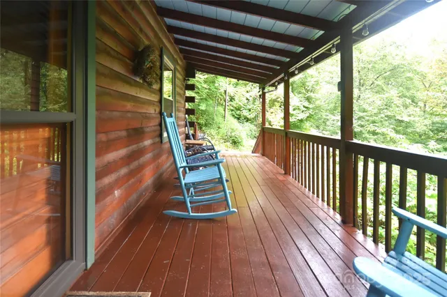 a view of outdoor space with wooden floor