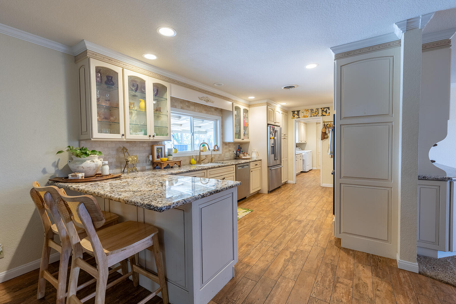 4444 Brandt Road Brawley, CA 92227 - Photo 30 of 93 a kitchen with granite countertop kitchen island wooden floor center island and stainless steel appliances