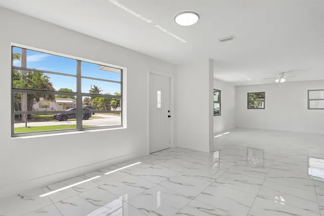 a view of an empty room with a window