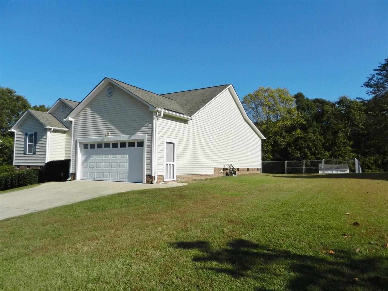245 Saddle Ridge Drive Willow Spring, NC 27592 - Photo 2 of 24 a front view of a house with yard and green space