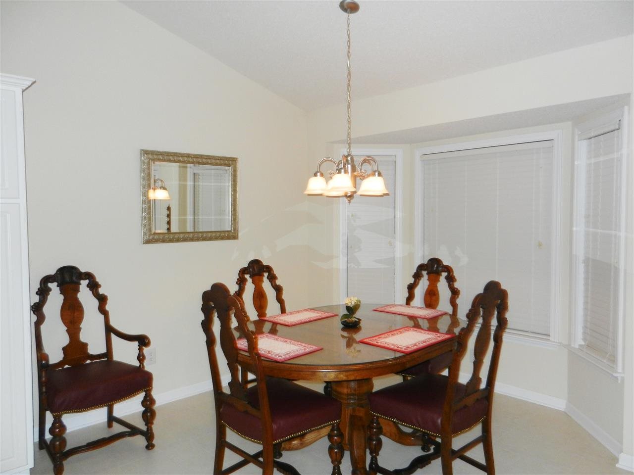 245 Saddle Ridge Drive Willow Spring, NC 27592 - Photo 12 of 24 a view of a dining room with furniture and chandelier