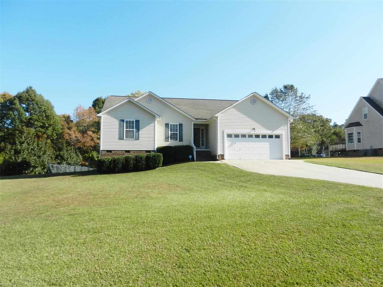 245 Saddle Ridge Drive Willow Spring, NC 27592 - Photo 24 of 24 a front view of a house with yard