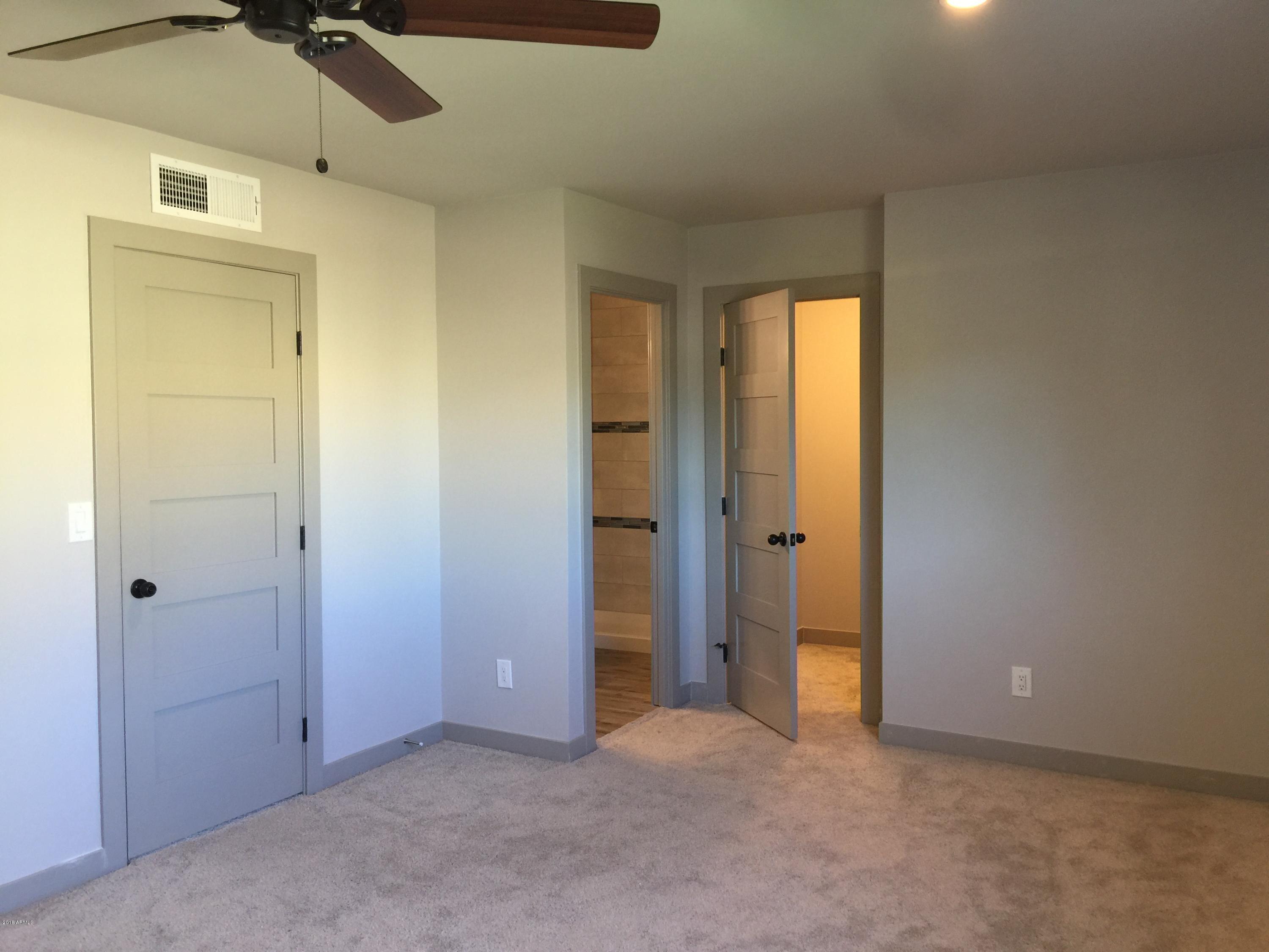 4221 North Miller Road Scottsdale, AZ 85251 - Photo 18 of 20 an empty room with a mirror