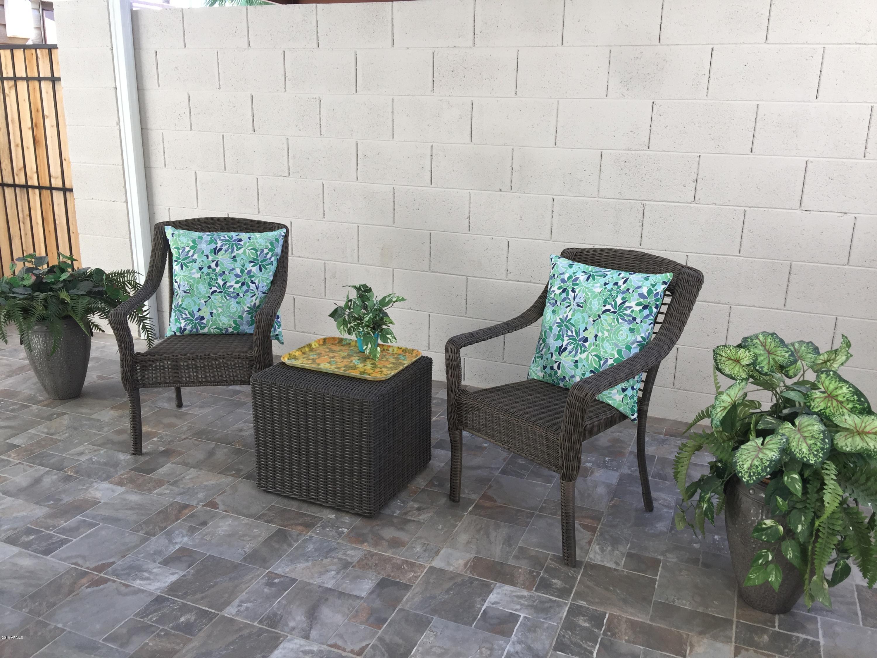 4221 North Miller Road Scottsdale, AZ 85251 - Photo 8 of 20 a view of a chairs and table in a patio