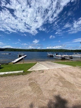 23 Arnold Road Douglas, MA 01516 - Photo 36 of 36 a view of a lake with a building in the background