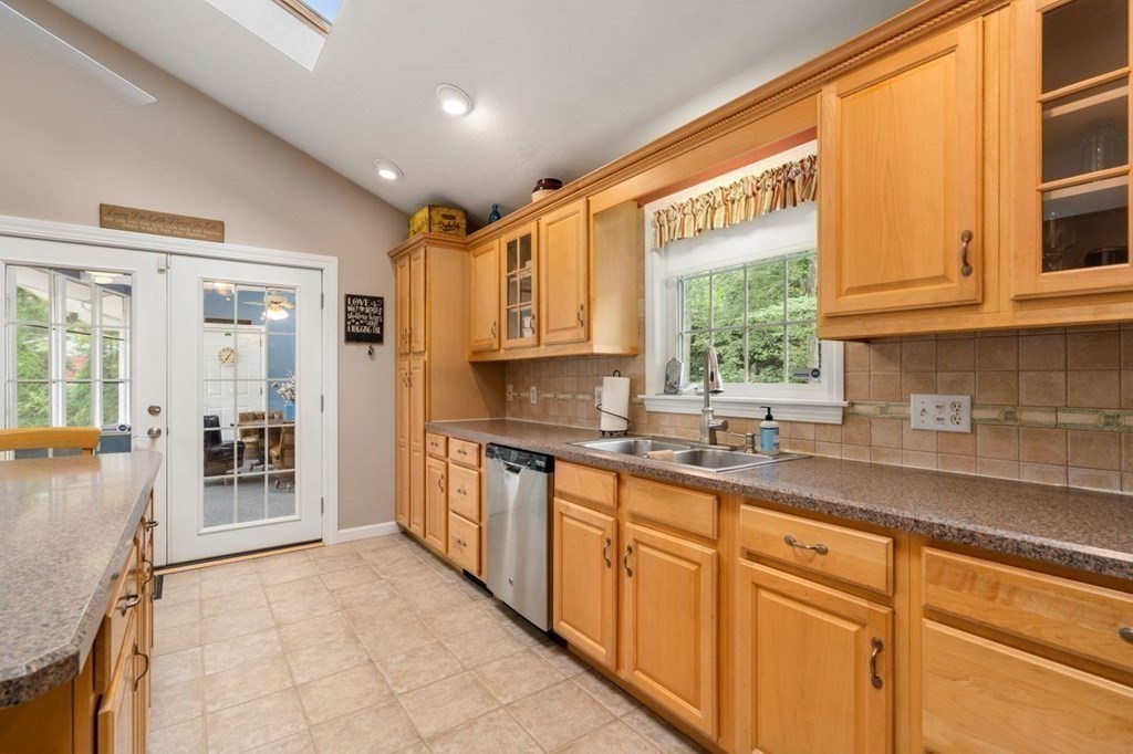 23 Arnold Road Douglas, MA 01516 - Photo 10 of 36 a kitchen with granite countertop a sink window and cabinets