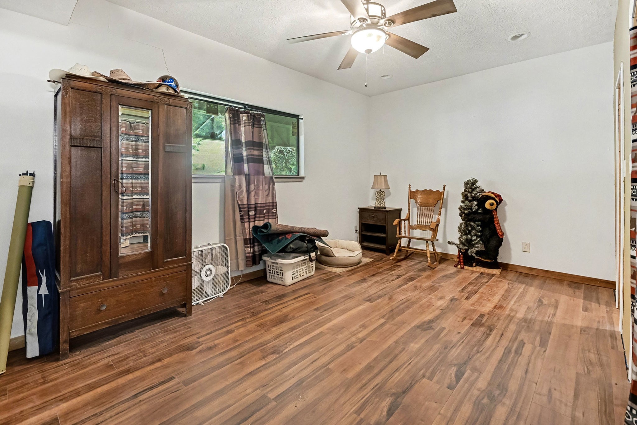 18303 Ramsey Road Crosby, TX 77532 - Photo 22 of 24 a view of a room with wooden floor and furniture