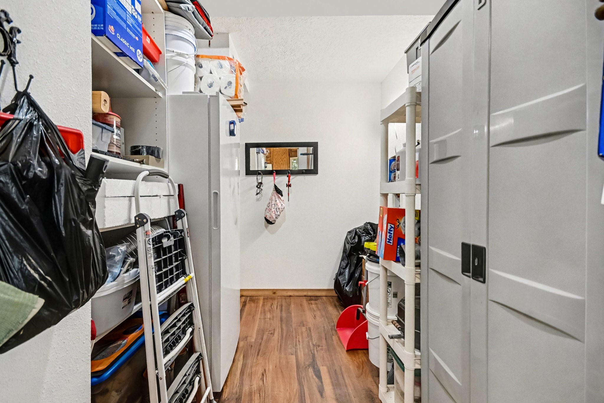 18303 Ramsey Road Crosby, TX 77532 - Photo 23 of 24 a view of walk in closet with clothes and shoes