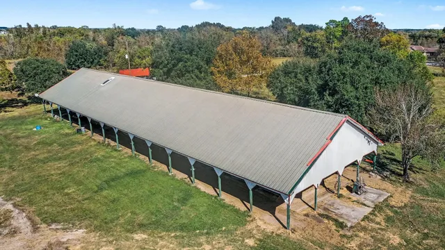 a view of a big house with a big yard