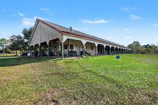 a view of house with a yard