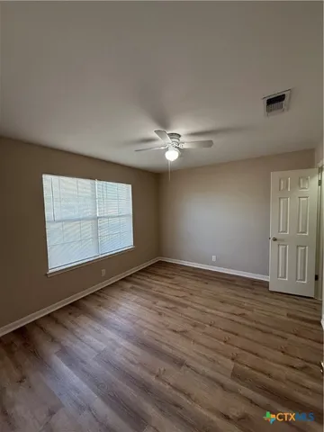a bathroom with a double vanity sink toilet mirror and bathtub