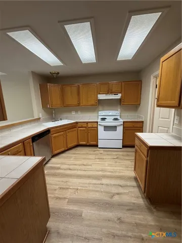 a view of staircase with white walls