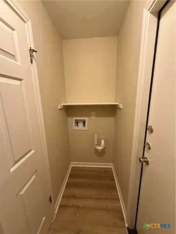 a view of room with window and hardwood