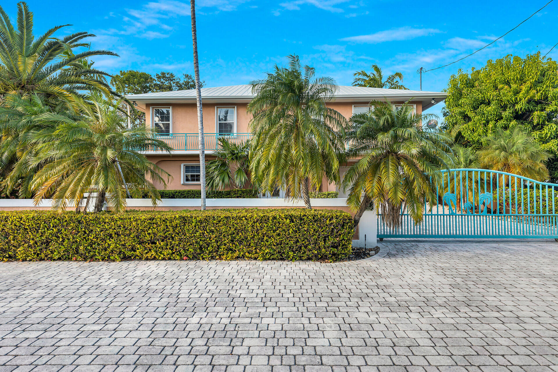 10 South Exuma Road Key Largo, FL 33037 - Photo 16 of 47 a front view of a house with a yard