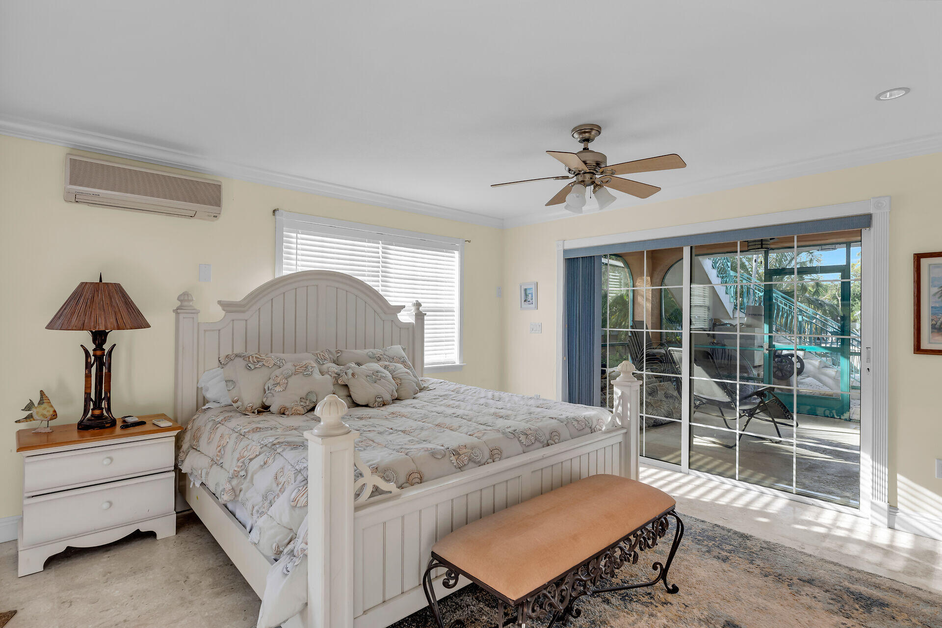 10 South Exuma Road Key Largo, FL 33037 - Photo 18 of 47 a bedroom with a bed and a chandelier