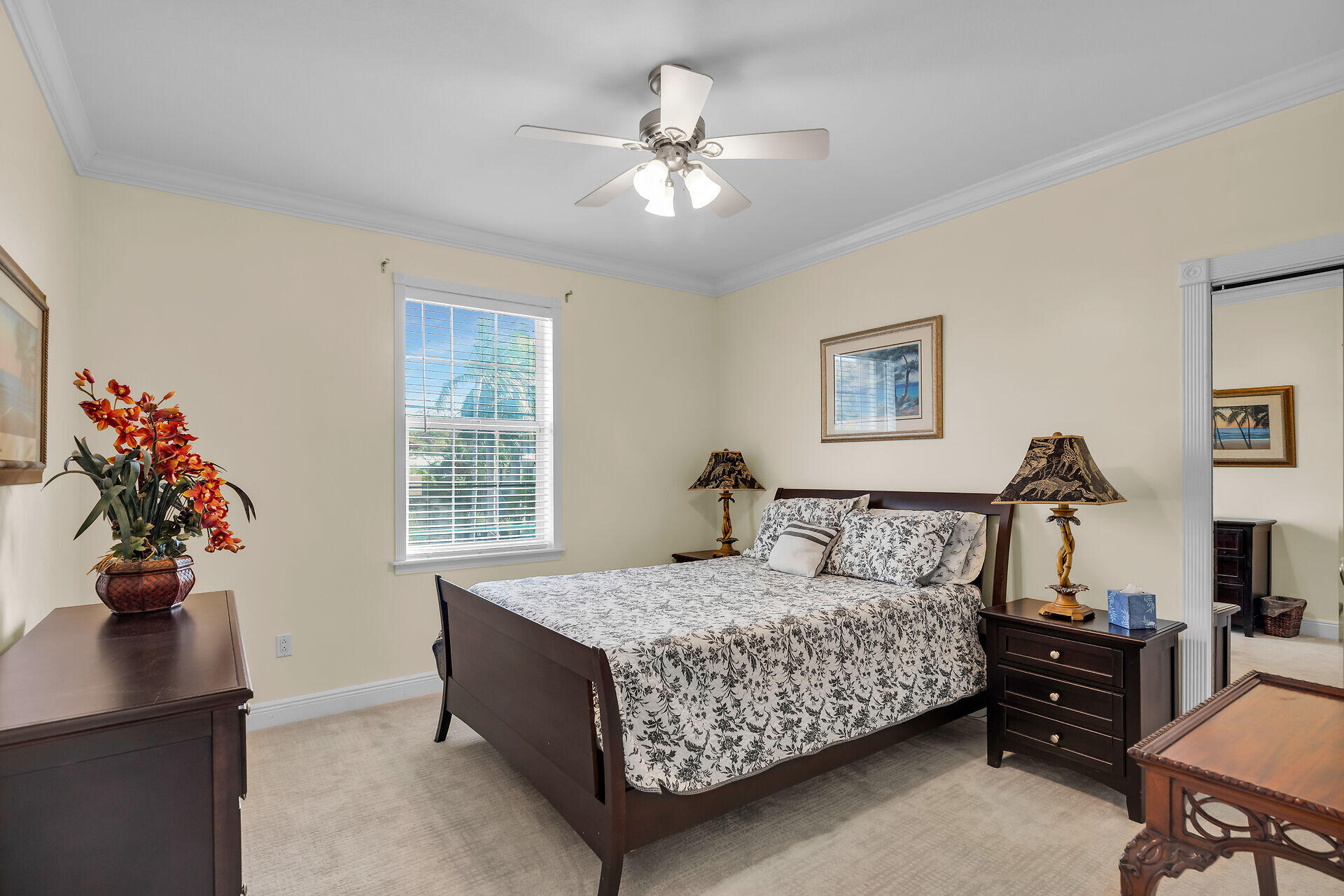 10 South Exuma Road Key Largo, FL 33037 - Photo 33 of 47 a bedroom with a bed and a chandelier