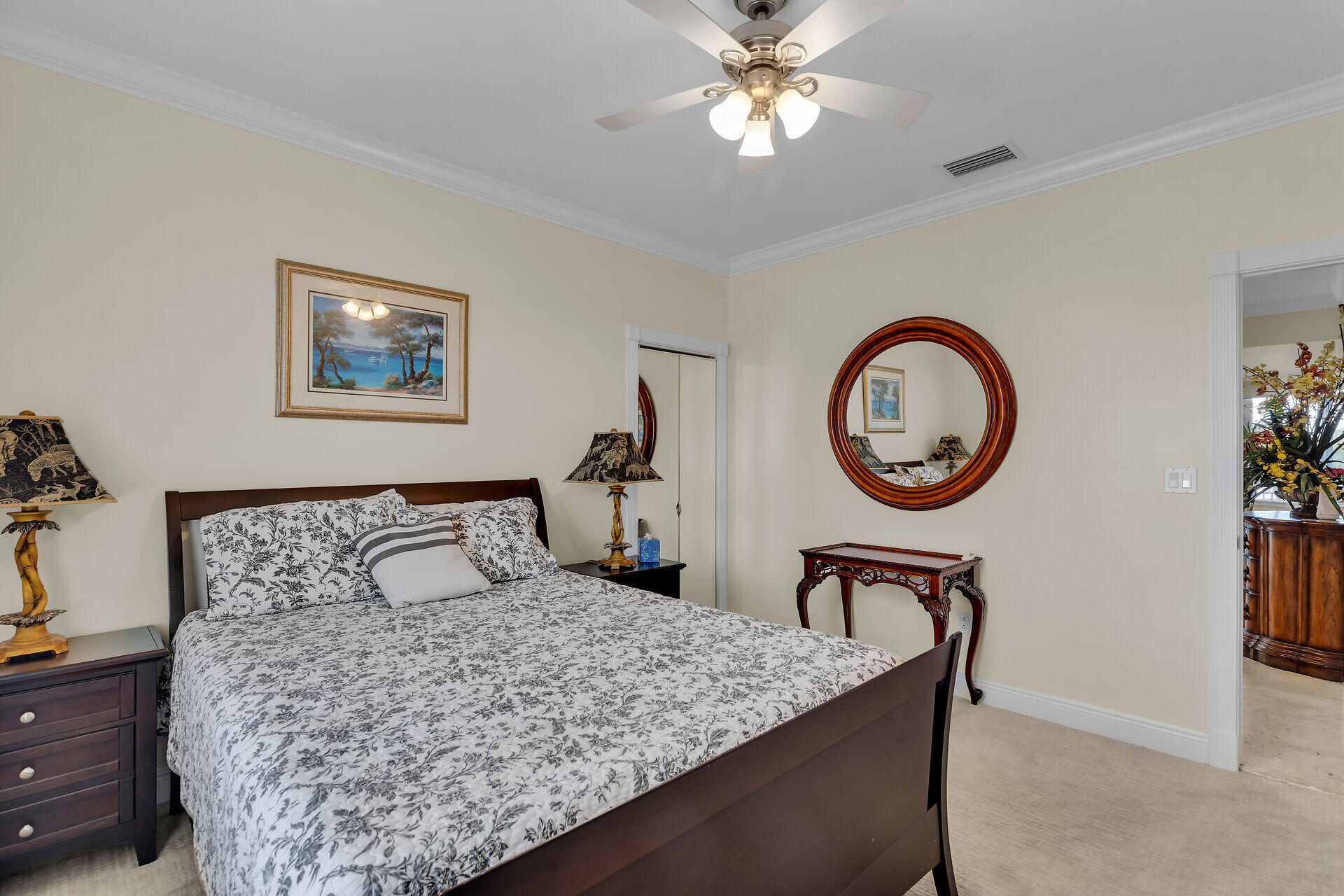 10 South Exuma Road Key Largo, FL 33037 - Photo 35 of 47 a bedroom with a bed and a chandelier