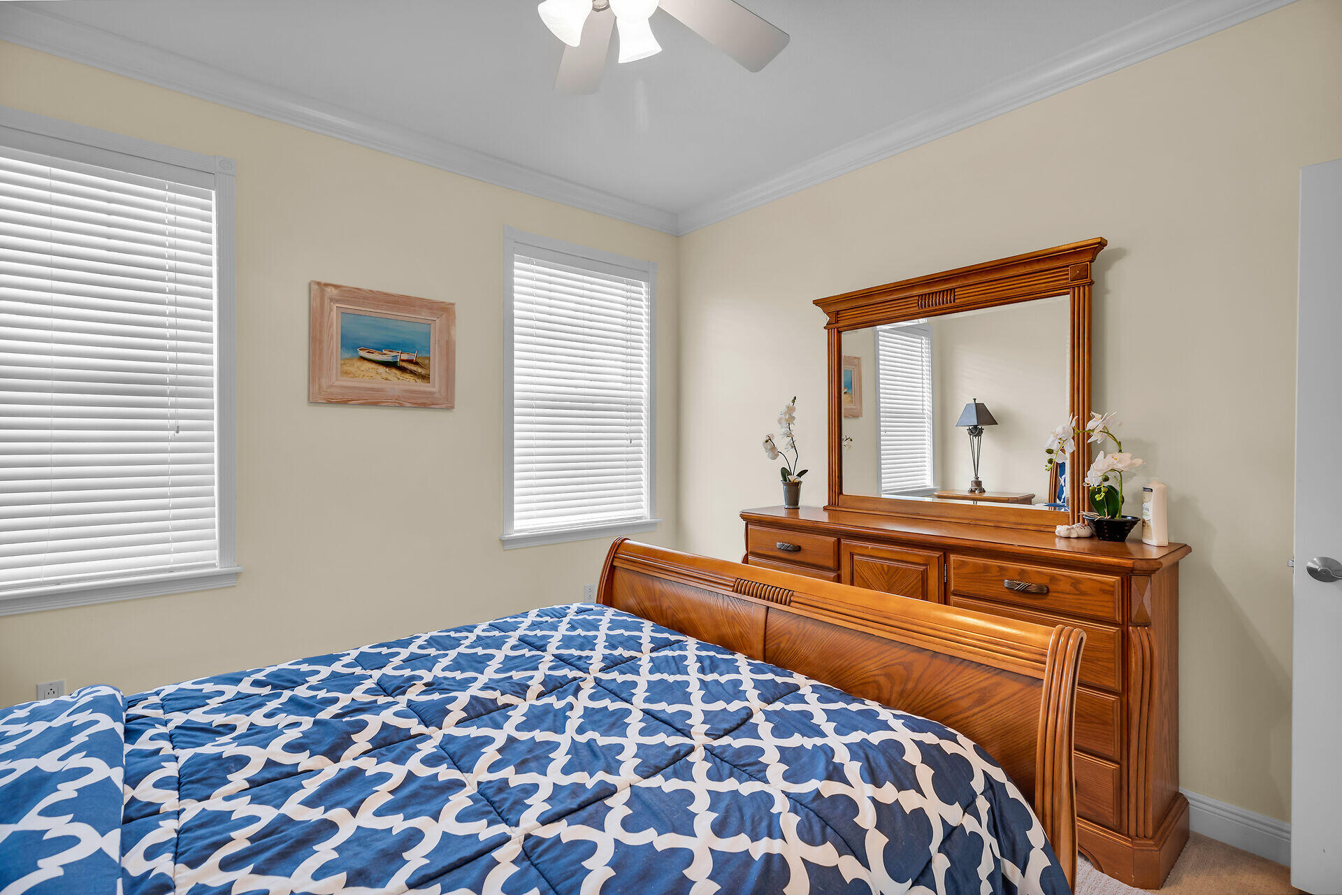 10 South Exuma Road Key Largo, FL 33037 - Photo 39 of 47 a bedroom with a large bed and a chandelier