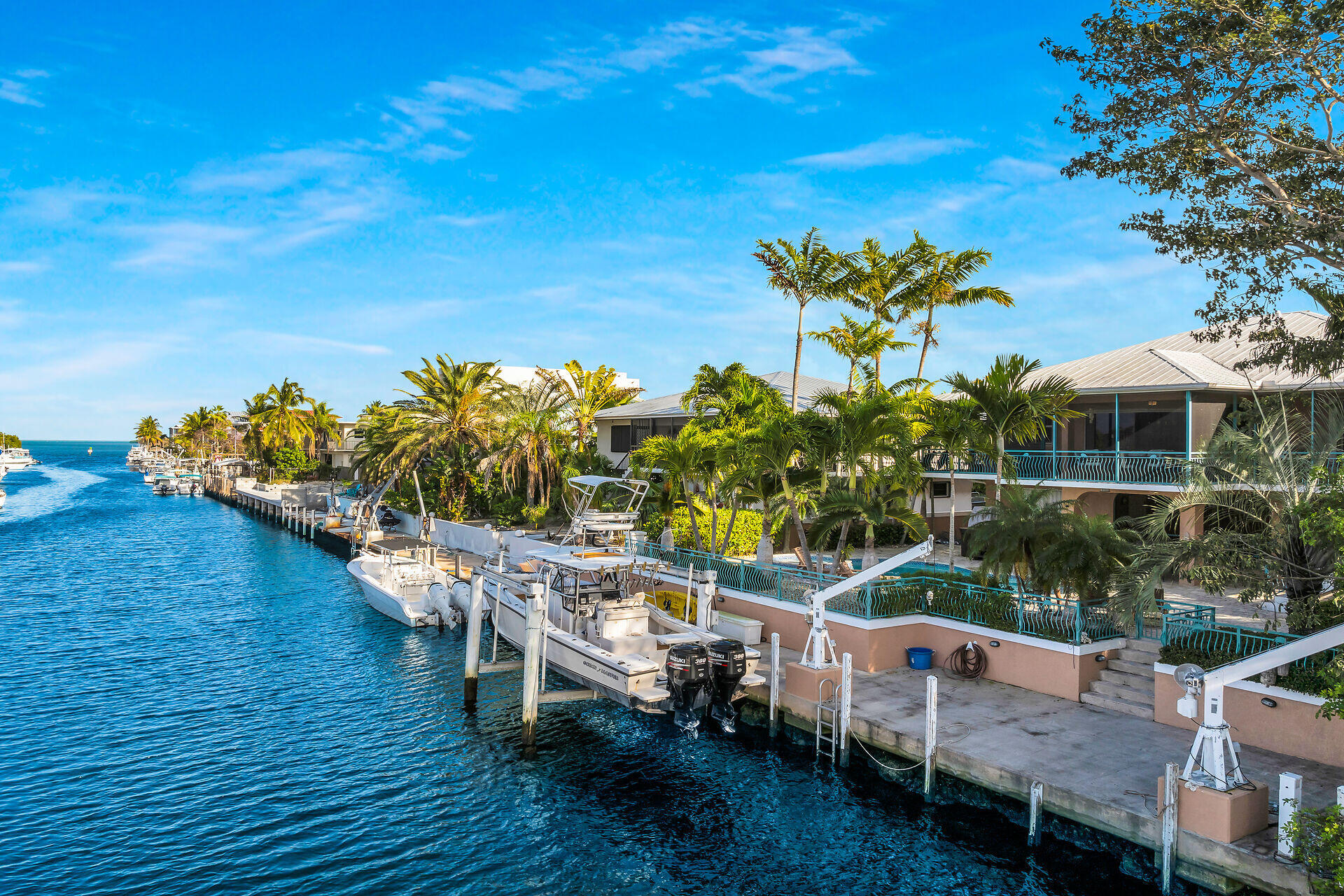 10 South Exuma Road Key Largo, FL 33037 - Photo 44 of 47 a view of a chairs and table on the wooden deck
