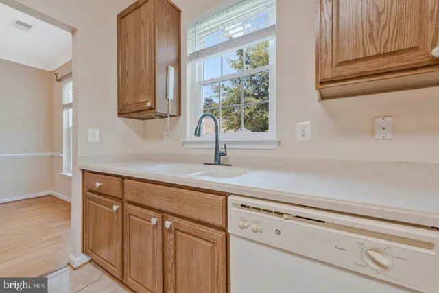 a kitchen with stainless steel appliances a refrigerator and a stove top oven
