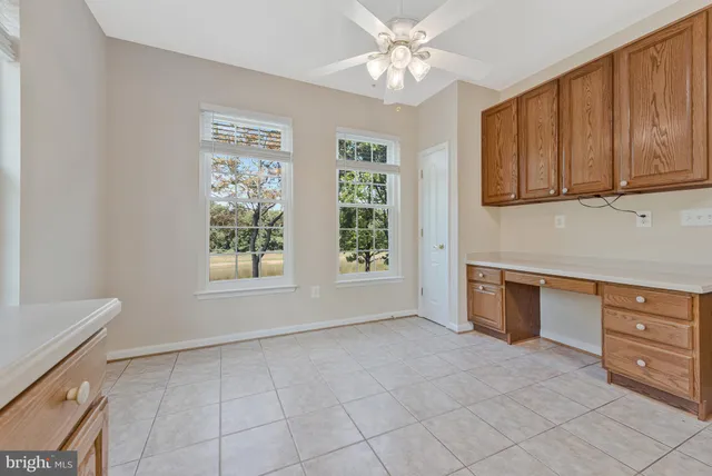 a utility room with cabinets washer and dryer