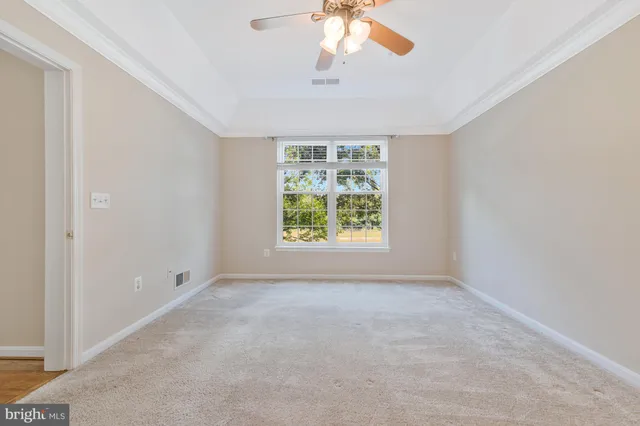 a bedroom with bed and a window