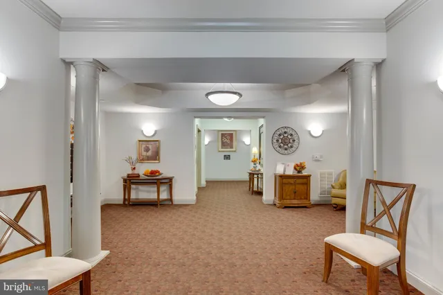 a view of a livingroom with furniture and a window