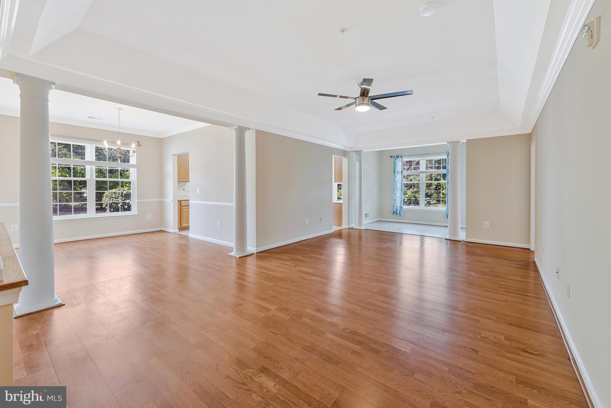 8600 Roaming Ridge Way, Unit 106 Odenton, MD 21113 - Photo 4 of 52 a view of empty room with wooden floor and fan