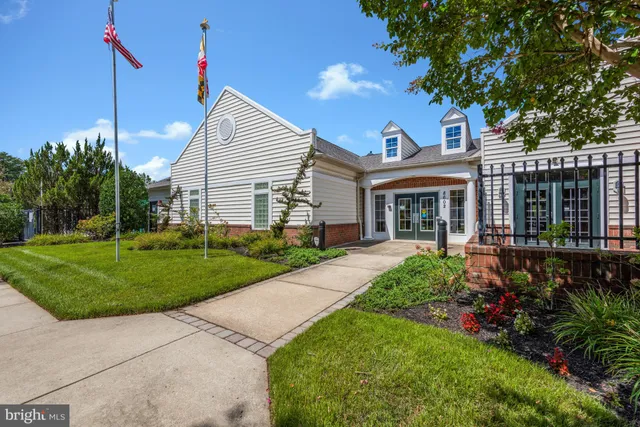 a view of multiple houses with a yard