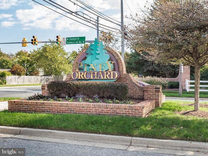 8600 Roaming Ridge Way, Unit 106 Odenton, MD 21113 - Photo 44 of 52 a view of a sign in front of a house