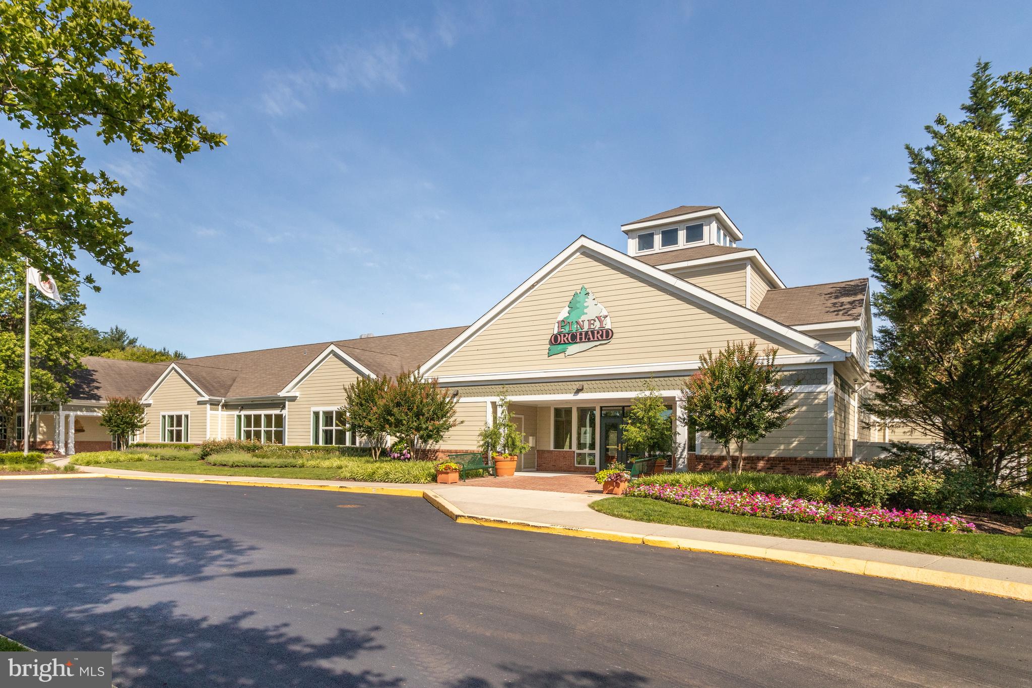 8600 Roaming Ridge Way, Unit 106 Odenton, MD 21113 - Photo 45 of 52 a view of pool with umbrella and wooden fence