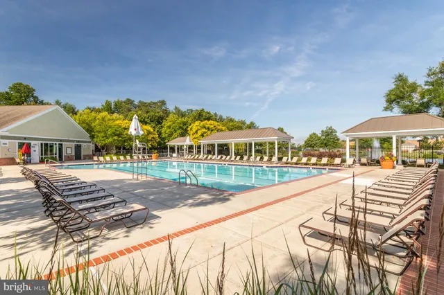 a bath tub sitting in a bathroom next to a window
