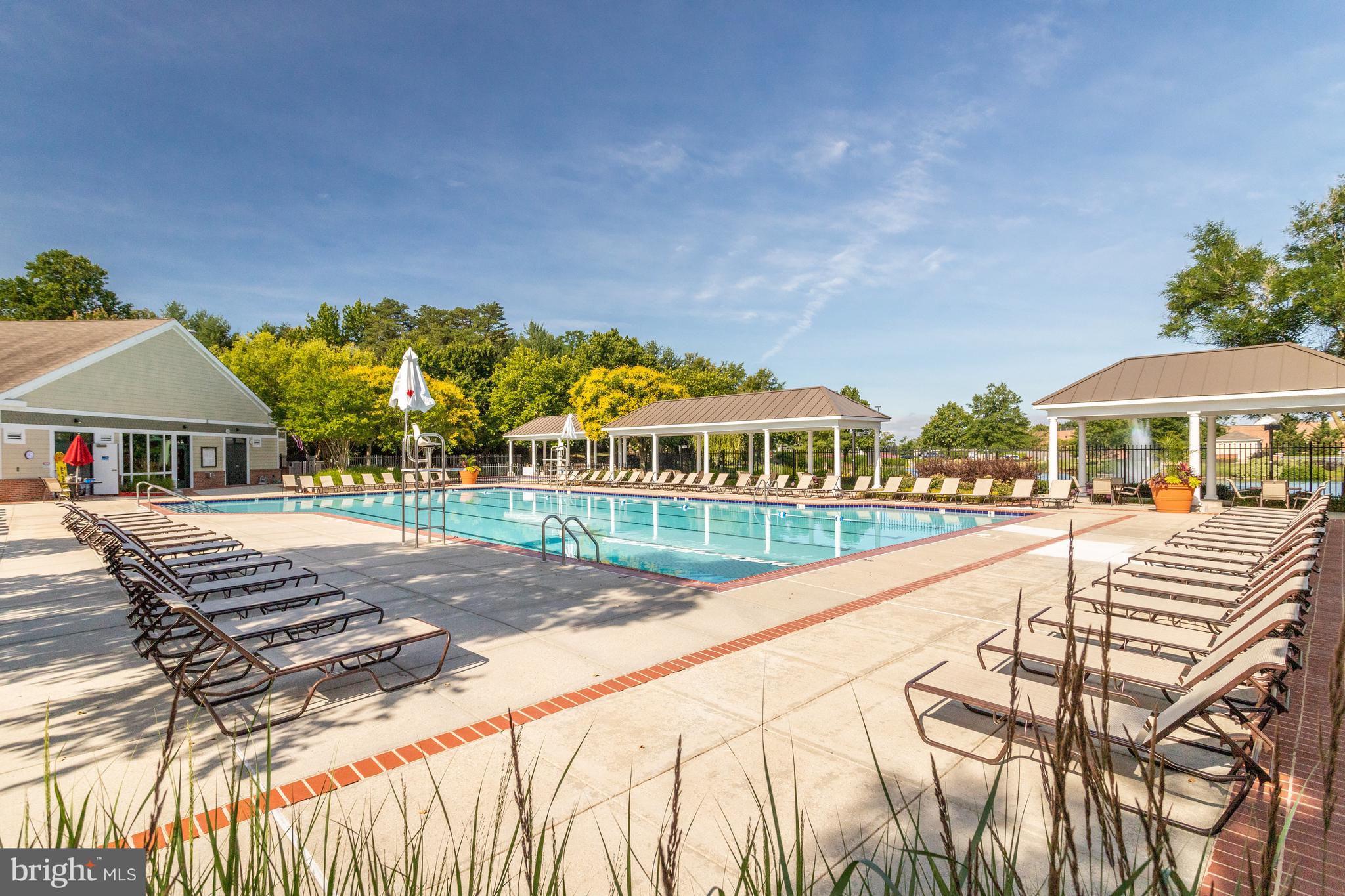 8600 Roaming Ridge Way, Unit 106 Odenton, MD 21113 - Photo 46 of 52 a view of house with swimming pool outdoor seating