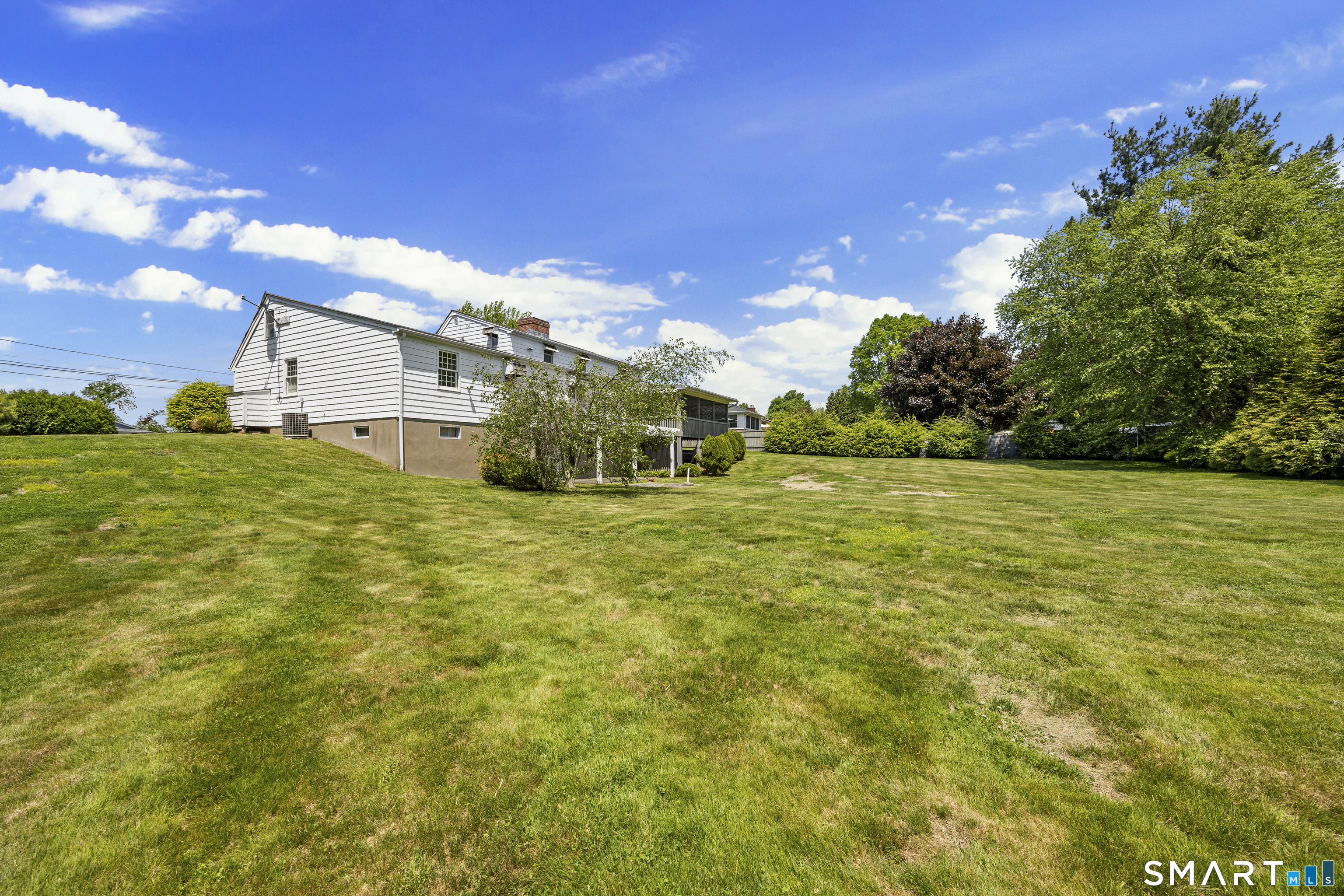 52 Susan Lane Meriden, CT 06450 - Photo 26 of 28 a view of a field with an trees in the background