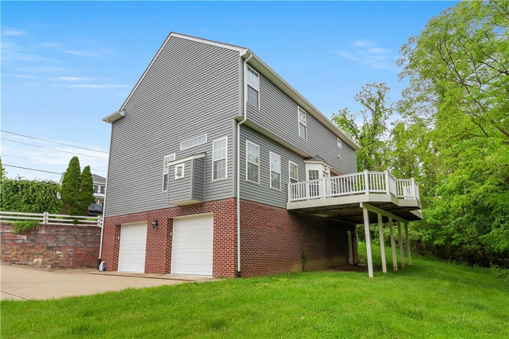 543 Hickory Grade Road Bridgeville, PA 15017 - Photo 31 of 32 a front view of house with yard and green space