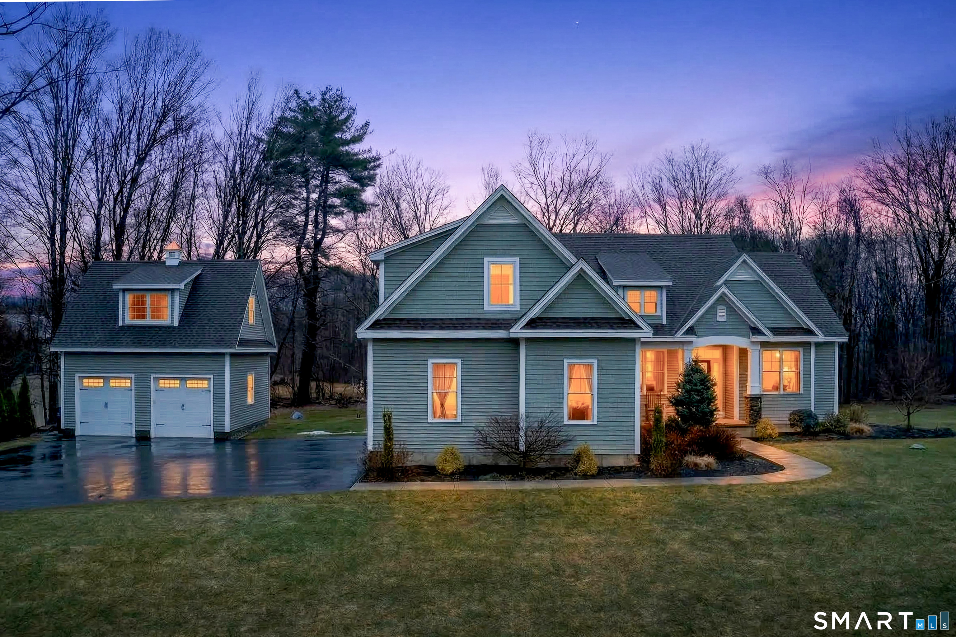 91 Hampden Road Stafford, CT 06076 - Photo 1 of 40 a front view of a house with a yard and trees