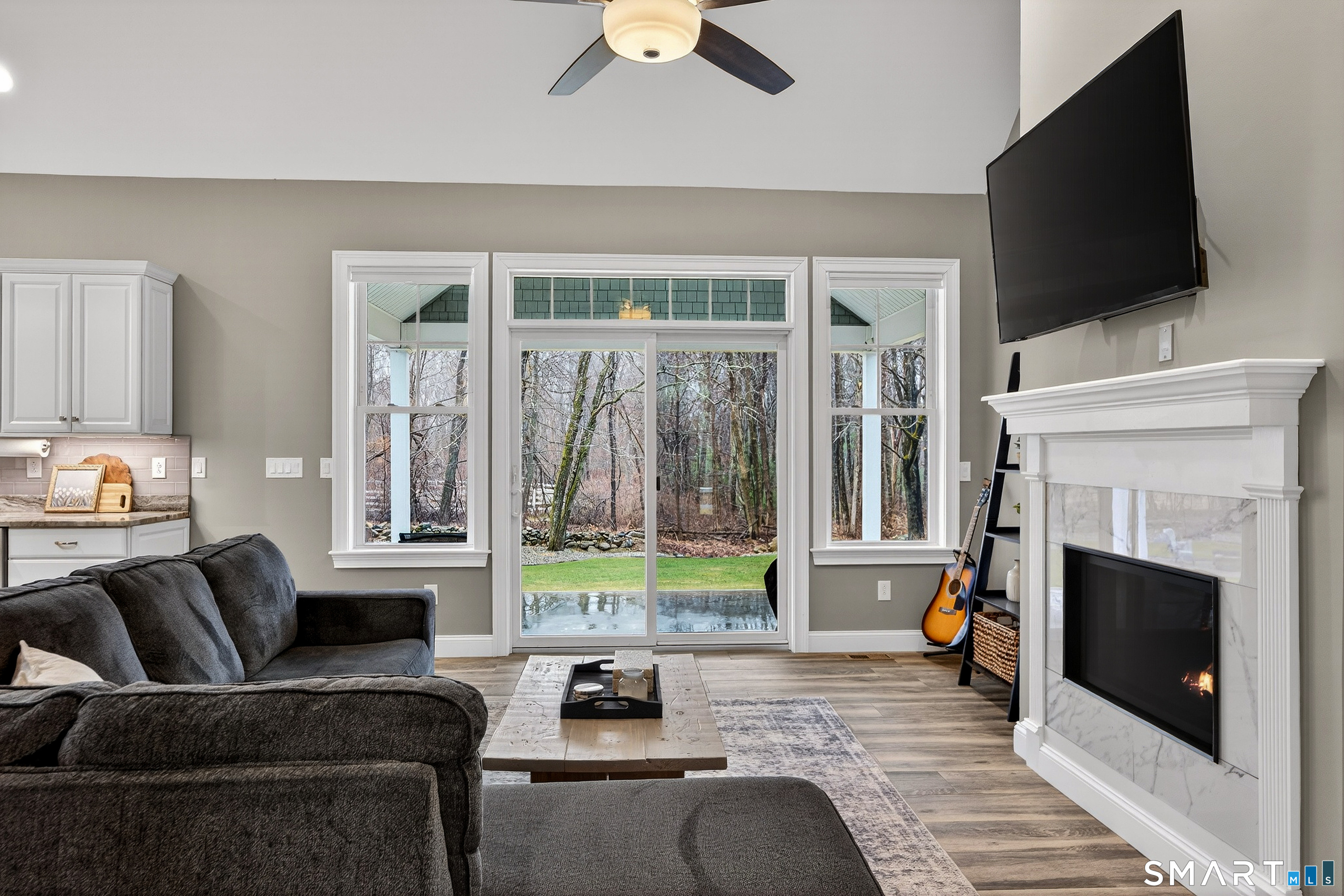 91 Hampden Road Stafford, CT 06076 - Photo 13 of 40 a living room with furniture and a flat screen tv